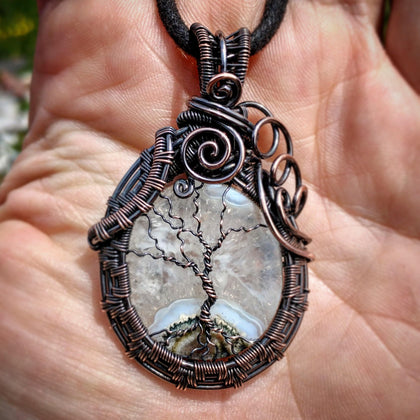 Wire wrapped copper sculpted tree of life on agate and quartz stone pendant