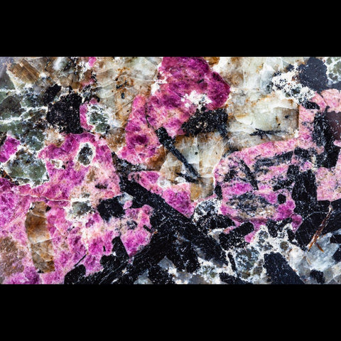 Pink Eudialyte crystals with white and black crystals