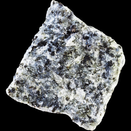 CLose up of angualr chunk of gabbaro stone with a white base and black speckles