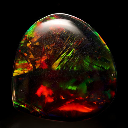 Black Opal with red green yellow and hints of other colors on a black background