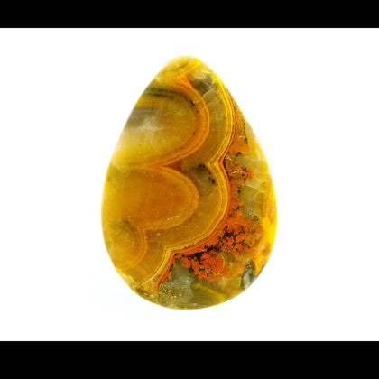 yellow cream and orange bumblebee jasper Oval shaped cabochon on white background