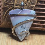 Blue and purple Jasper pendant on natural background