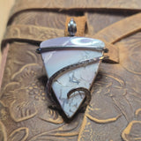 Purple and blue Jasper pendant in sterling silver on natural background