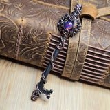 Decorative skeleton key with intricate design on a textured surface