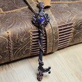 Decorative skeleton key with intricate design on a textured surface