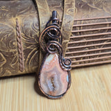 Jewelry with a stone and metalwork on a textured surface