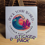 Sticker pack with 'Rock Your World' design and text on a wooden surface