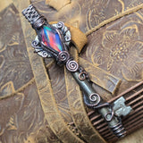 Antique number 1 skeleton key pendant with rainbow Aurora Opal and copper wire wrap.