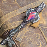 Antique number 1 skeleton key pendant with rainbow Aurora Opal and copper wire wrap.