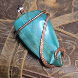 Green Jasper in Copper Wrap on pattern leather surface