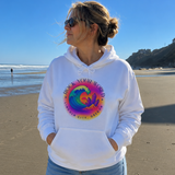 Person wearing a white hoodie with a colorful graphic on a beach
