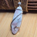 Marble-patterned hook on a wooden surface