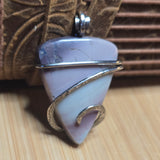 Pastel colored Jasper pendant on natural background