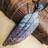 Amethyst Lace carved stone feather wrapped in sterling and rose gold fill in a hand