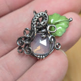 Lavender Moon Quartz pumpkin pendant wrapped in oxidized sterling silver with a green Czech glass leaf.