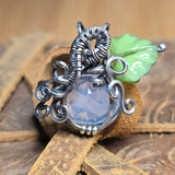Lavender Moon Quartz pumpkin pendant wrapped in oxidized sterling silver with a green Czech glass leaf.