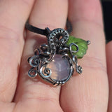 Lavender Moon Quartz pumpkin pendant wrapped in oxidized sterling silver with a green Czech glass leaf.