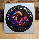 Colorful sticker with crystal design and text on a wooden surface