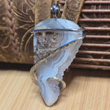 Agate pendant on natural background 