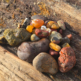 Colorful stones on a wooden surface