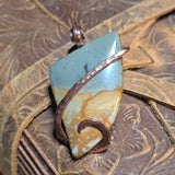 Pendant with a natural stone design on a textured surface
