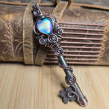 Decorative key pendant against neutral background