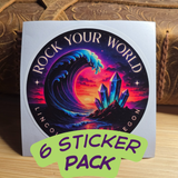 Sticker pack with 'Rock Your World' design featuring a wave and crystals, on a wooden surface.