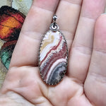 Natural Pink and Black Rhodochrosite Pendant in Sterling Silver
