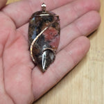 Pink Rhodonite Pendant – Forged Embrace in Rose Gold-Filled Wire - Rock Your World 
