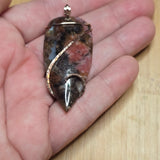 Pink Rhodonite Pendant – Forged Embrace in Rose Gold-Filled Wire - Rock Your World 