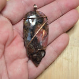 Pink Rhodonite Pendant – Forged Embrace in Rose Gold-Filled Wire - Rock Your World 