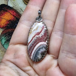 Natural Pink and Black Rhodochrosite Pendant in Sterling Silver