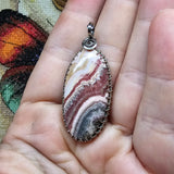 Natural Pink and Black Rhodochrosite Pendant in Sterling Silver