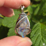 Boulder Opal Pendant with Blue Fire – Sterling Silver Forged Embrace