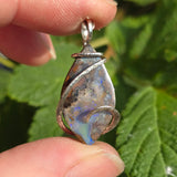 Boulder Opal Pendant with Blue Fire – Sterling Silver Forged Embrace
