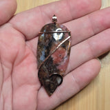 Pink Rhodonite Pendant – Forged Embrace in Rose Gold-Filled Wire - Rock Your World 