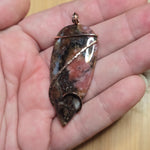 Pink Rhodonite Pendant – Forged Embrace in Rose Gold-Filled Wire - Rock Your World 