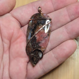 Pink Rhodonite Pendant – Forged Embrace in Rose Gold-Filled Wire - Rock Your World 