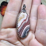 Natural Pink and Black Rhodochrosite Pendant in Sterling Silver