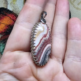 Natural Pink and Black Rhodochrosite Pendant in Sterling Silver