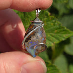 Boulder Opal Pendant with Blue Fire – Sterling Silver Forged Embrace