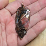 Pink Rhodonite Pendant – Forged Embrace in Rose Gold-Filled Wire - Rock Your World 