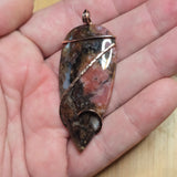 Pink Rhodonite Pendant – Forged Embrace in Rose Gold-Filled Wire - Rock Your World 