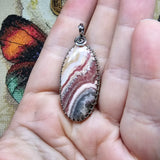 Natural Pink and Black Rhodochrosite Pendant in Sterling Silver