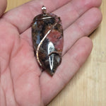 Pink Rhodonite Pendant – Forged Embrace in Rose Gold-Filled Wire - Rock Your World 