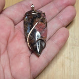 Pink Rhodonite Pendant – Forged Embrace in Rose Gold-Filled Wire - Rock Your World 