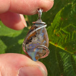 Boulder Opal Pendant with Blue Fire – Sterling Silver Forged Embrace