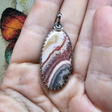 Natural Pink and Black Rhodochrosite Pendant in Sterling Silver