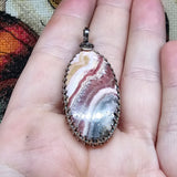 Natural Pink and Black Rhodochrosite Pendant in Sterling Silver