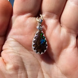 Shimmering Drop Boulder Opal Pendant in Sterling Silver